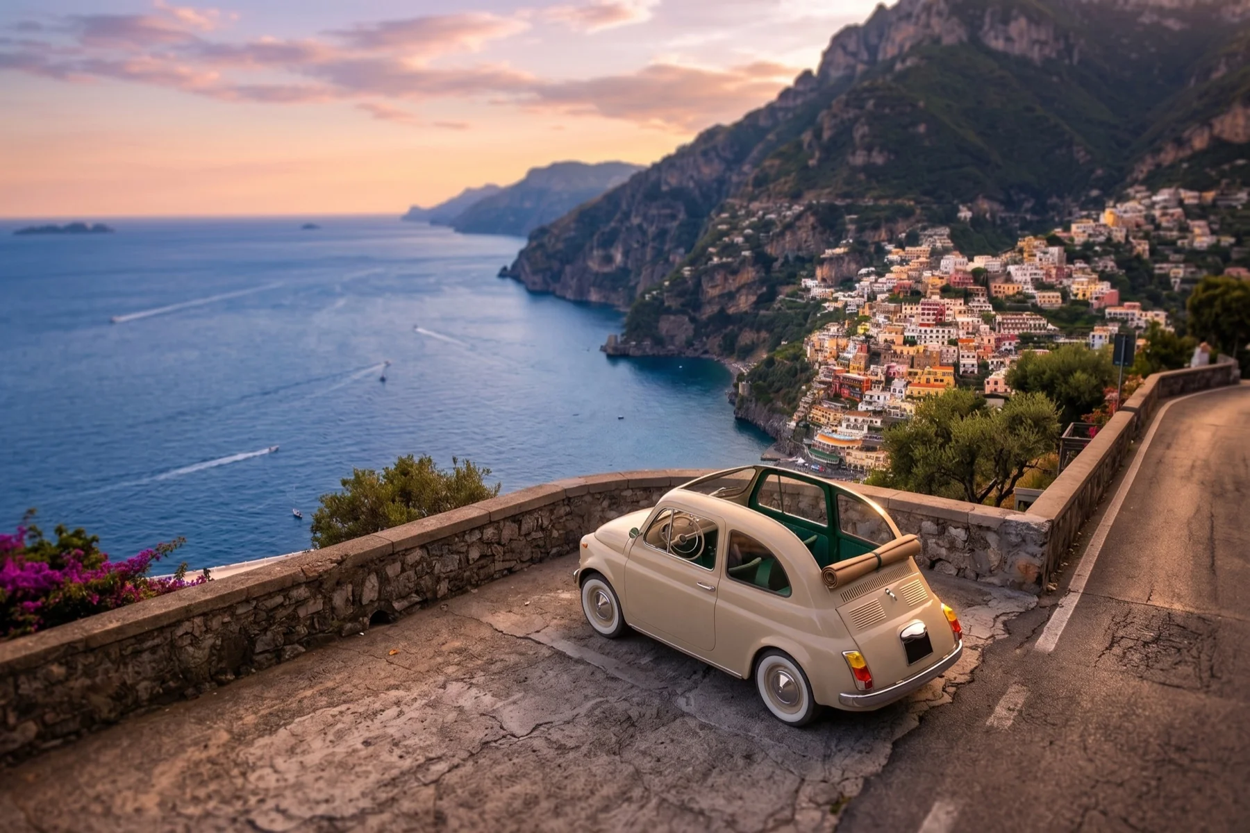 Rivivente Fiat 500 on a sunlit coastal road above the Amalfi shoreline.